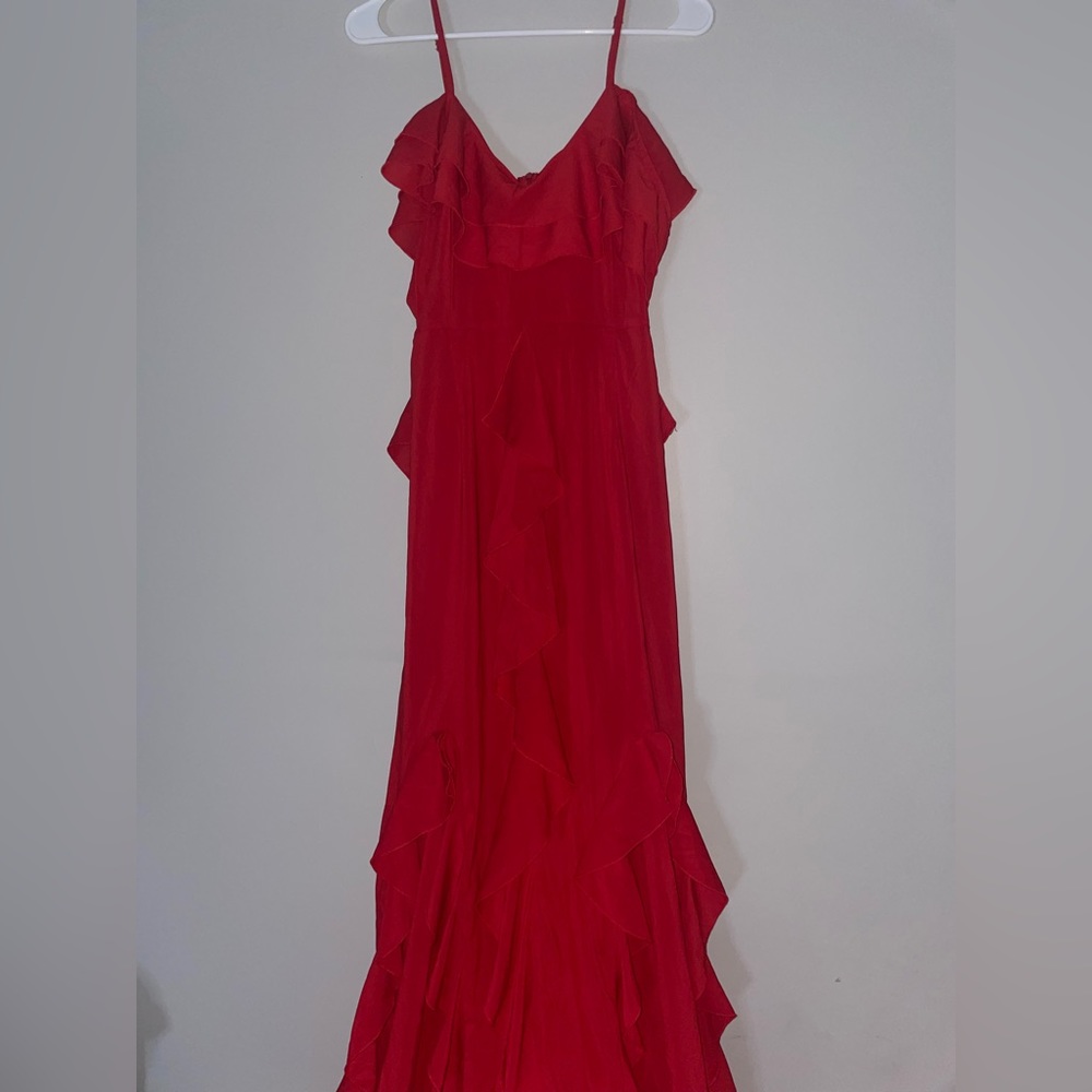 Long red PLT dress with 2 slits at the bottom and off the shoulder sleeves